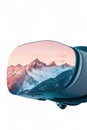 Virtual reality headset displays snowy mountains and pine trees under a colorful sky, representing immersive digital experiences Royalty Free Stock Photo