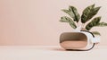Virtual reality headset with green leaves emerging, representing digital immersion and growth in the metaverse. Royalty Free Stock Photo