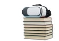 Virtual reality headset on stack of books isolated on transparent background Royalty Free Stock Photo