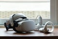 Virtual Reality Headset on the Wood Table in the Morning, Interactive Next Generation Computer Technology for Relaxation and Enjoy Royalty Free Stock Photo