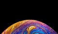 Virtual reality space with abstract multicolor psychedelic planet. Closeup Soap bubble like an alien planet on black background