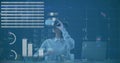 Virtual reality user interacting with data visualization image over charts