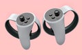 Virtual reality white controllers for online and cloud gaming on pink Royalty Free Stock Photo