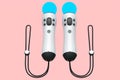 Virtual reality white controllers for online and cloud gaming on pink Royalty Free Stock Photo