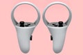 Virtual reality white controllers for online and cloud gaming on pink Royalty Free Stock Photo