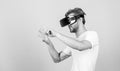 Virtual simulation. Man play game in VR glasses. Explore cyber space. Man hipster virtual reality headset on peach