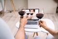 Virtual Wine Tasting Using Laptop. Online Party Royalty Free Stock Photo