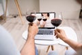 Virtual Wine Tasting Using Laptop. Online Party Royalty Free Stock Photo