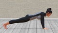 Virtual Woman with Sport Outfit in Yoga Plank Pose with a clear wood floor