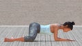 Virtual Woman in Yoga Frog Pose with a clear wood floor