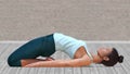 Virtual Woman in Yoga Reclined Hero Pose with a clear wood floor