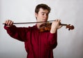 Virtuoso Teen Male Violinist in red