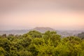 Virunga Volcanoes and Mgahinga Gorilla National Park from Kisoro in colorful early morning with mist in the valley. Kisoro Distric