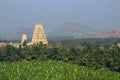 Virupaksha Temple among mountains and palm plantations on sunrise Royalty Free Stock Photo