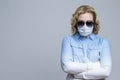 Virus Concepts.Coronavirus of Caucasian Woman Wearing Flu Virus Mask For Viral Prevention. Against Gray background Royalty Free Stock Photo