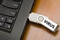 IT virus enter laptop computer via USB thumb drive or USB stick Royalty Free Stock Photo