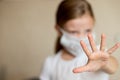 Virus mask child wearing face protection in prevention for coronavirus showing gesture Stop Infection.little girl in