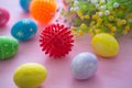 Virus model of Coronavirus disease COVID-19 with colorful easter eggs with flowers on a pink wooden table background Royalty Free Stock Photo