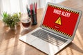 Virus warning alert on computer screen detected modish cyber threat Royalty Free Stock Photo