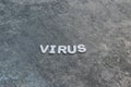 Virus written out on gray background with white lettering