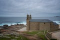 Virxe da Barca Sanctuary in Galicia with Cabo Vilan Lighthouse on the background in Galicia, Spain