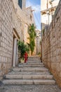 Vis, Croatia - Aug 19, 2020: Old town street stone stairs near port in summer time Royalty Free Stock Photo