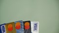 Visa card and mastercard cards isolated green background, elektonoc plastic card. Batam, Indonesia - March, 30, 2023