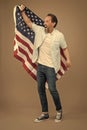 Visa free. Happy man get USA visa grey background. Visa applicant hold usa flag. Applying for immigrant visa to american Royalty Free Stock Photo