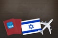 Visa with Israel flag, passport and airplane, trip travel immigration Royalty Free Stock Photo