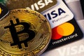 Visa and MasterCard logo on plastic electronic cards with bitcoin Royalty Free Stock Photo