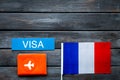 Visa to France concept. French flag near passport on dark wooden background top-down copy space Royalty Free Stock Photo