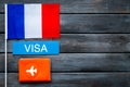 Visa to France concept. French flag near passport on dark wooden background top-down copy space Royalty Free Stock Photo