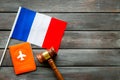 Visa to France concept. French flag near passport and hammer on dark wooden background top-down copy space Royalty Free Stock Photo