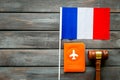 Visa to France concept. French flag near passport and hammer on dark wooden background top-down copy space Royalty Free Stock Photo