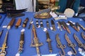 Weapons and vendors in period costumes at a Renaissance Faire