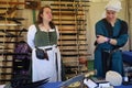 Weapons and vendors in period costumes at a Renaissance Faire