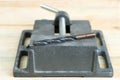 The vise to clamp on a wooden desktop environment tools Royalty Free Stock Photo