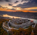 Visegrad, Hungary - Aerial panoramic drone view of the beautiful high castle of Visegrad with autumn foliage and trees