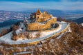 Visegrad, Hungary - Aerial view of the beautiful snowy high castle of Visegrad at sunrise on a winter morning