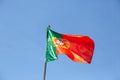 View of a flag of Portugal on a flagpole waving in the wind Royalty Free Stock Photo