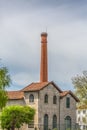 Viseu / Portugal - 04 16 2019 : View of the Museum of electricity, top building with chimney in industrial brick, in the enclosure