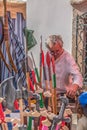 View of a sales stand, with handmade toys, man selling at the Medieval Fair of Canas de Senhorim