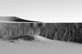 Dunes on the outskirts of Sahara Desert. Sand wall with beautiful textures. Monochromatic, black and white. Morocco, Africa Royalty Free Stock Photo