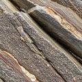 The visible striations and fractures suggest tectonic activity Royalty Free Stock Photo