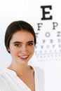 Vision. Beautiful Woman With Visual Eye Test Chart On Background Royalty Free Stock Photo