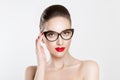 Vision. Closeup attractive fashion sexy girl wearing eye glasses woman holding her pair of glasses isolated white light grey