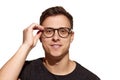 Close-up portrait of young handsome man wearing eyewear isolated on white studio background. Concept of men's health