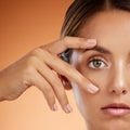 Vision, eye and beauty with face of woman for health awareness, awake and idea in orange background. Youth, cosmetics Royalty Free Stock Photo