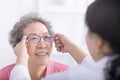 Vision, glasses with doctor and patient, eyes health and optometry, senior woman with doctor at clinic