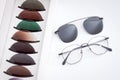 Vision glasses frame near many colored ophthalmological lenses for solar rays protection